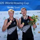 Oliver Welch (left) and Ben Taylor celebrate their gold medal at the Seville round of the world...