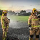 Donovan Harvey (left) during a training exercise with the Pukerau Volunteer Fire Brigade. PHOTO:...