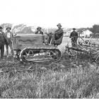 Holt 2-ton Caterpillar at work on H. Voss's farm, Willowbridge, hauling a 17-tine cultivator. —...