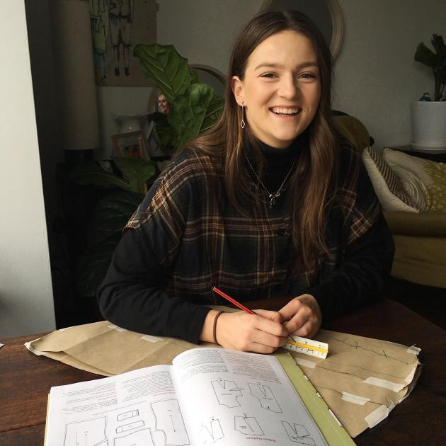 Dunedin fashion student Sophie Stevens works on her designs. Photo: supplied