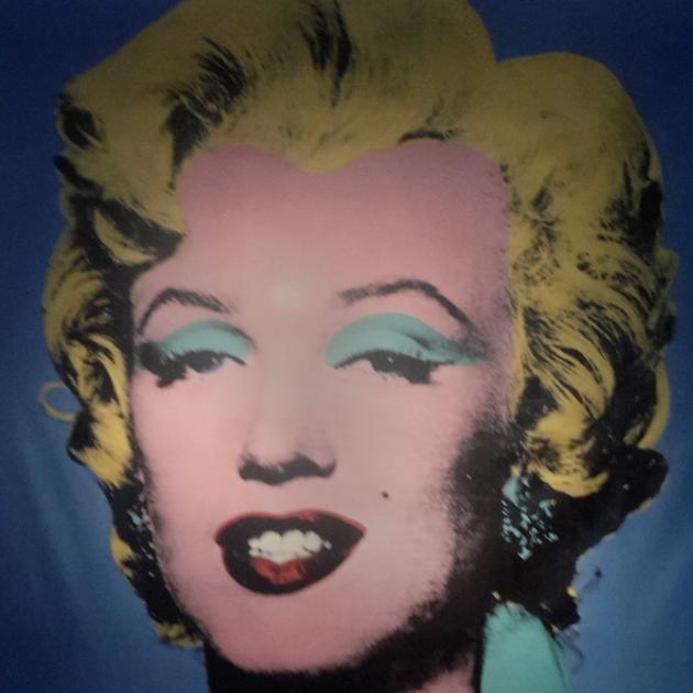 Marilyn Monroe stares down from the wall in the entrance to Andy Warhol exhibition in Rome.PHOTO:...