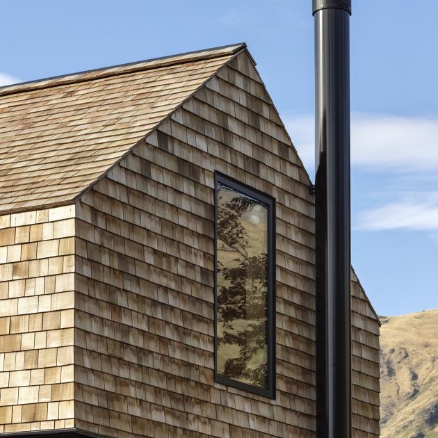 Using a single material on the roof and walls made for a clean and seamless exterior. The house...