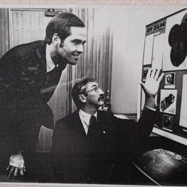 United States astronaut Robert L Crippen and Minister of Scicence Dr Shearer study a DSIR display...
