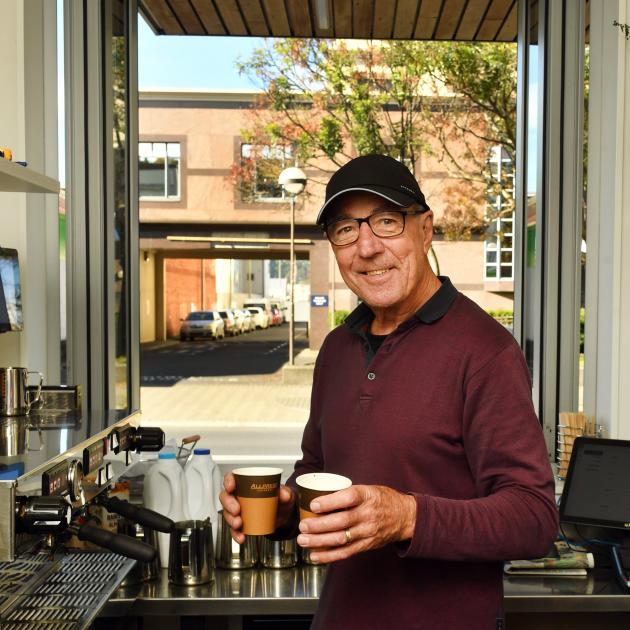 Chris Baker reckons it is much warmer across the street at his new Coffee Hub kiosk in Great King...