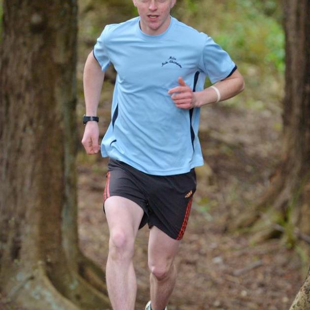 Dunedin runner Joseph Beamish trains in the Town Belt yesterday as he prepares to study and compete at Taylor University in the United States. Photo by Gerard O'Brien