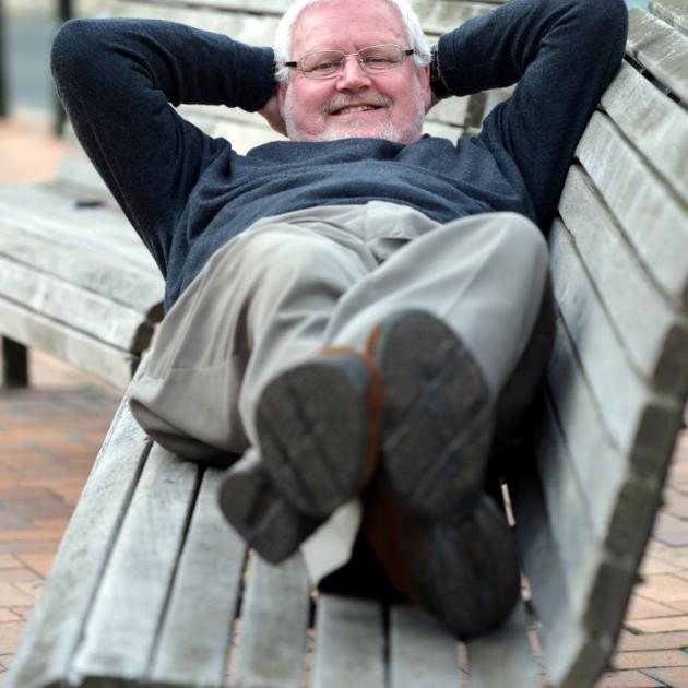 Dunedin Night Shelter Trust chairman Dave Brown tests the benches in the Octagon. He, along with trust board member John Le Brun and Labour MP  David Clark, will be ''sleeping rough'' in the Octagon on Sunday night to raise money for the night shelter. Ph