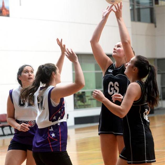 Southern C shooter Steph Brenssell puts up a shot during a senior club match against the South Pacific Titans during the weekend. Also pictured are (from left) Caitlin Balkin, Puawai Shortland and Te Wai Tamati. PHOTO:  LINDA ROBERTSON