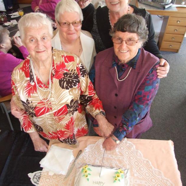 Cutting the birthday cake for Milton Elder Care yesterday are (clockwise from left) Joyce Duncan, the longest-serving member of Milton Elder Care; Heather Mills, chairwoman of the Milton Elder Care Trust; Ruth Gorton, co-ordinator for the elder care grou Cutting the birthday cake for Milton Elder Care yesterday are (clockwise from left) Joyce Duncan, the longest-serving member of Milton Elder Care; Heather Mills, chairwoman of the Milton Elder Care Trust; Ruth Gorton, co-ordinator for the elder care grou