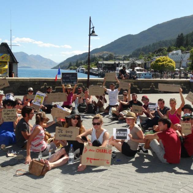 French nationals gather in Queenstown yesterday in support of French newspaper Charlie Hebdo, attacked by terrorists yesterday. Photo by Tracey Roxburgh.  