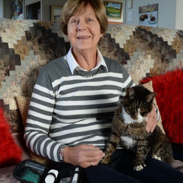 Barbara Sutherland, of Waikouaiti, who has Type 1 diabetes, pictured with pet cat Target, says she would hate to think of higher-order animals being in pain. PHOTO: LINDA ROBERTSON