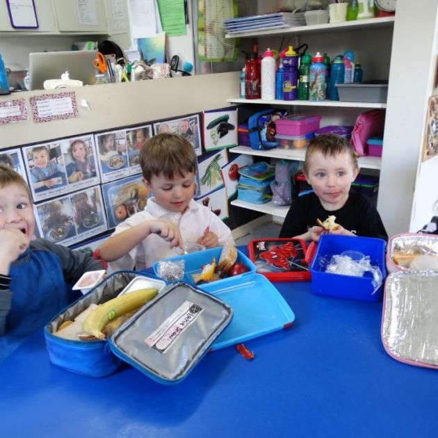 Enjoying the healthy contents of their lunch boxes at Play & Learn Fairfield are (from left) Lachie Shaw (4), Theo Johnston (4), Tai Nicolaou (4) and Indy Nicolaou (2). Photo by Brenda Harwood