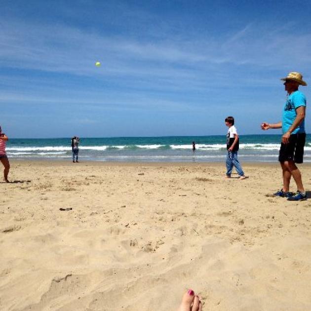 Alex Carmichael (8) attempts to hit a ball bowled by Phil Borland while Adam Borland (12) watches  at Kaka Point. Photo supplied