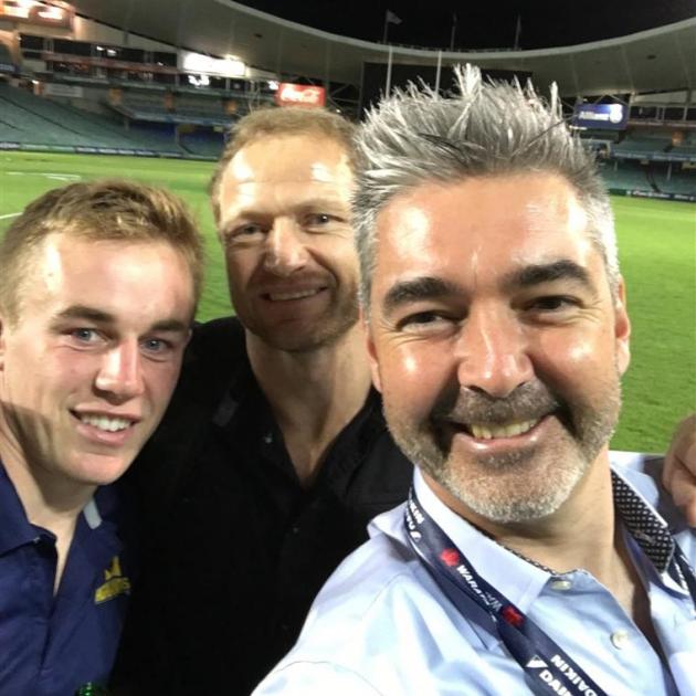 From left: Highlanders back Hayden Parker, assistant coach Tony Brown and part owner Matthew Davey in Sydney earlier this season. Photo: supplied