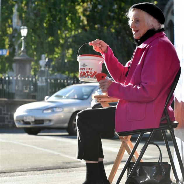 Norma Burton running the Knox Church poppy day stall on the corner of George and Frederick Sts yesterday. Photo: Peter McIntosh