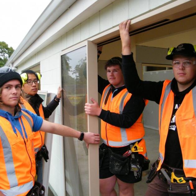 CPIT Aoraki pre-trade builders (from left) Marc Palmer, Robert Zhao, Hadley Martin and James South,  help out at Timaru’s Park Centre. PHOTO: AL WILLIAMS 
