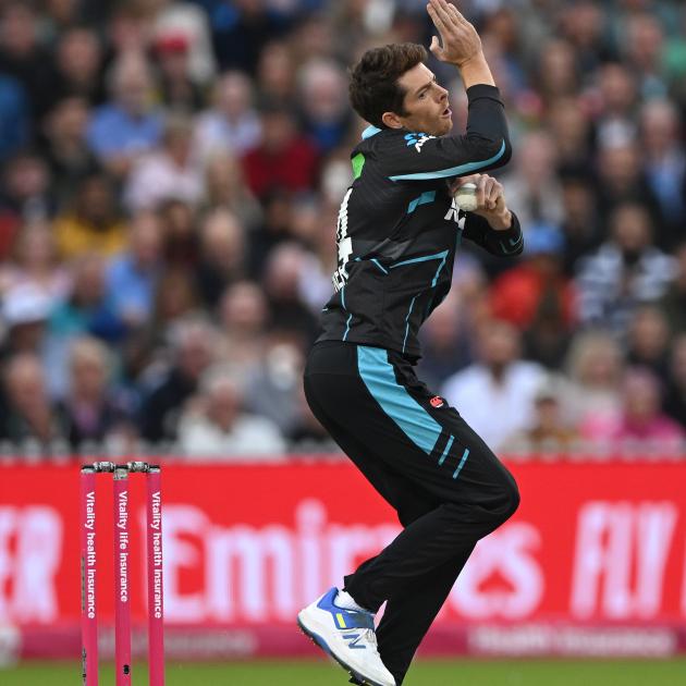 Black Caps spinner Mitchell Santner bowls against England in the T20 international in Manchester...