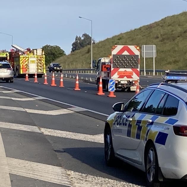 Emergency services at the scene of the crash on Dunedin's Southern Motorway this morning. Photo:...