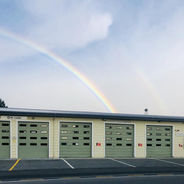 A rainbow forms above Twizel fire station as rain begins to this morning. Photo: Craig Baxter