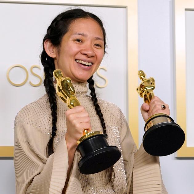 Chloe Zhao with her Academy Awards for Best Picture and Best Director. Photo: Reuters