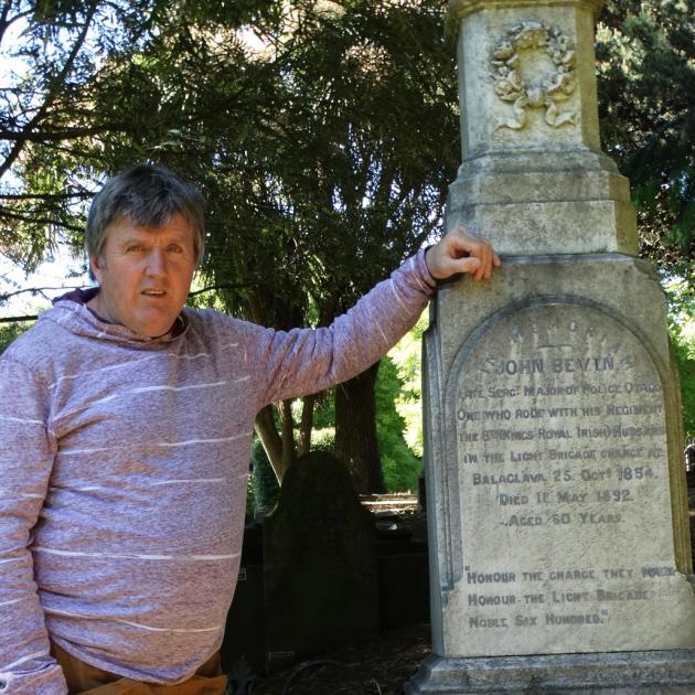 Dunedin historian Peter Trevathan pictured with the grave of John Bevin, who survived the Charge...