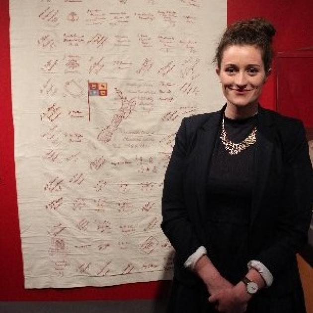 Exhibition curator Katherine Neville-Lamb with a signature quilt made by Otago women which was sent to men injured in World War 1 to have on their hospital beds. PHOTO: ELLA STOKES