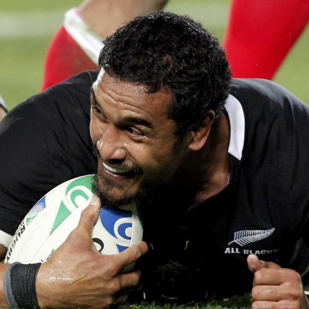 New Zealand All Blacks' Jerome Kaino smiles after scoring a try against Tonga during their Rugby...