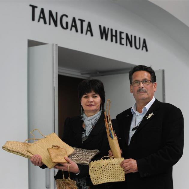 Margot Yates and John Broughton with their grandmother's 100-year-old kete, which they have...