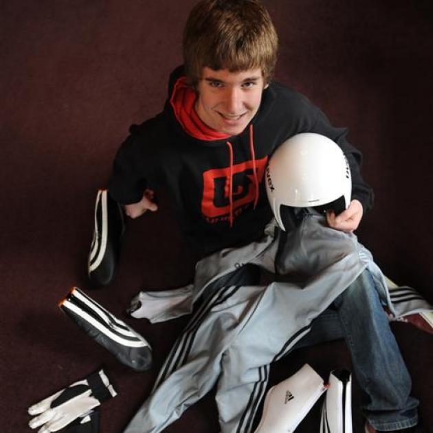 Matheson Hill with some of the gear he wears competing in the luge. Photo by Peter McIntosh.