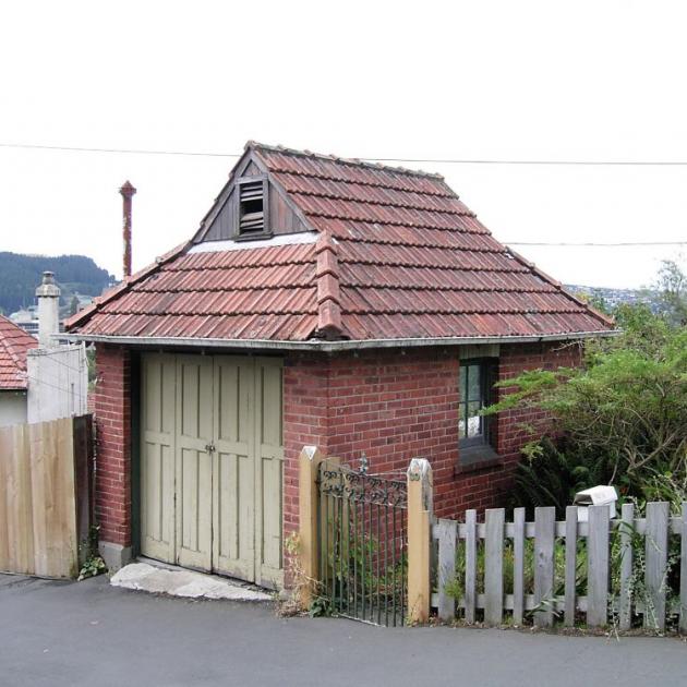 The earliest known private garage in Dunedin is in Park St, built in 1912. Amazingly, it retains its original doors. PHOTO: SUPPLIED
