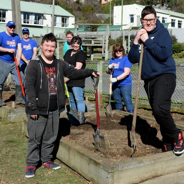 Sarah Cohen School pupils Levi Toki (18, foreground left), and Josh Anderson (20, right) help prepare a garden at the school with support from volunteers (from left) Selwyn Smith and Russell Robson, of the BNZ, Amelia Cruice and Rachael Mills, of the Univ