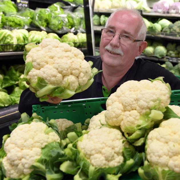 Veggie Boys Albany St owner Marty Hay with what he reckons is the ``cheapest cauliflower in the country'', at $4.99 each. Photo: Stephen Jaquiery
