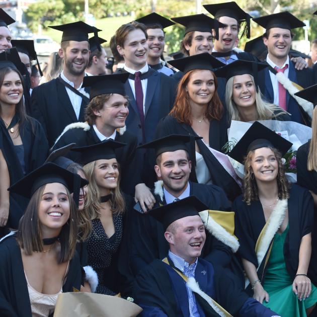 Graduates take part in the University of Otago graduation parade along George St on Saturday...