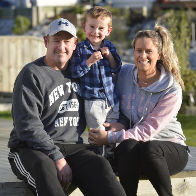 Harry Finch lifts his leg yesterday at his Abbotsford home with parents Hayden and Bex. PHOTO:...