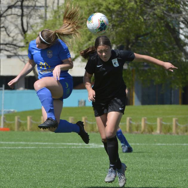 Southern United midfielder Chelsea Whittaker (left) seeks to head the ball in front of Capital's...