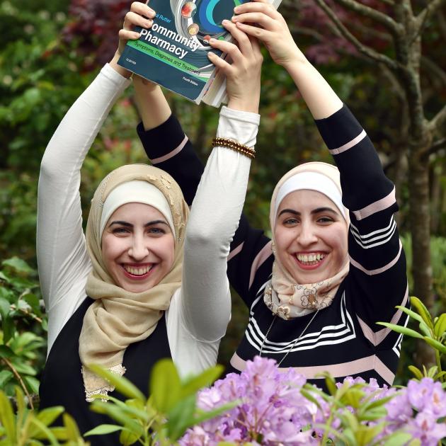 Identical twins Dareen and Nadeen Saleem (24) prepare to graduate from the University of Otago...