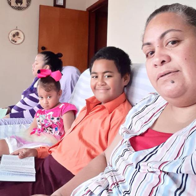 Reading from the Bible are the Vai family (from left) Lute, Akolotu, Tevita and Lea Vai. PHOTO:...