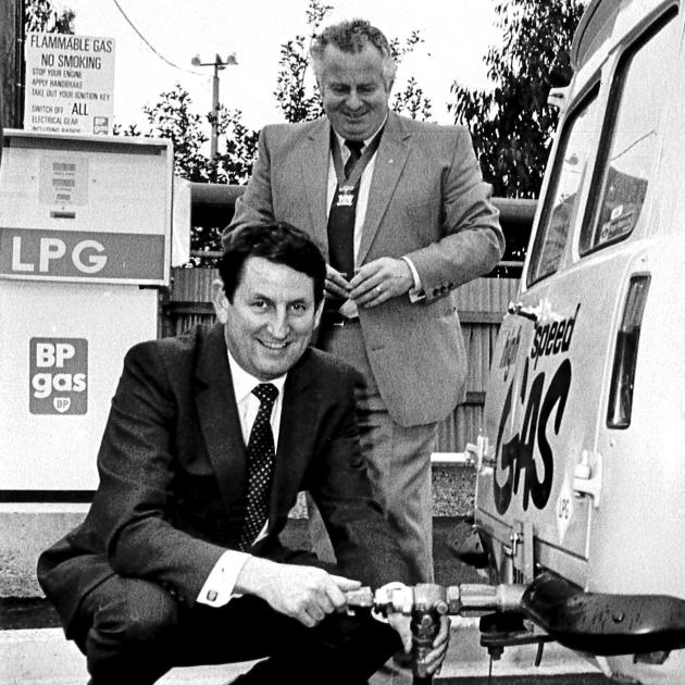 Bill Birch (front), who was the driving force behind Think Big energy projects, poses with...
