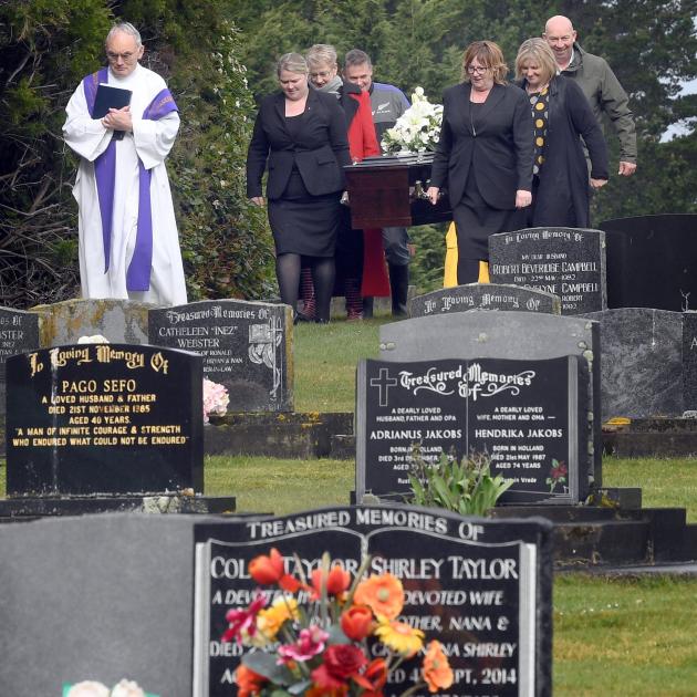 Led by Monsignor John Harrison, the coffin of Keith Sellar is carried by (clockwise from front...