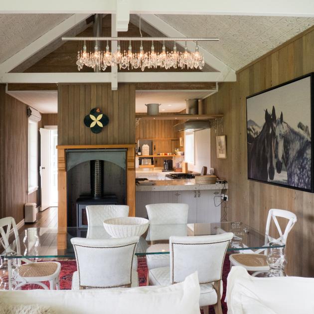 Pressed tin panels on the ceilings contrast with the timber walls and floors.