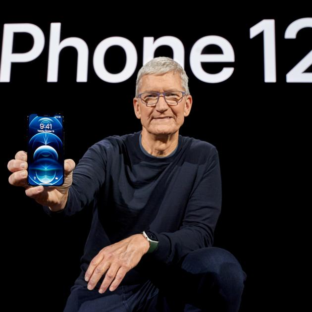 Apple CEO Tim Cook poses with the all-new iPhone 12 Pro. Photo: Brooks Kraft/Apple Inc./Handout via Reuters