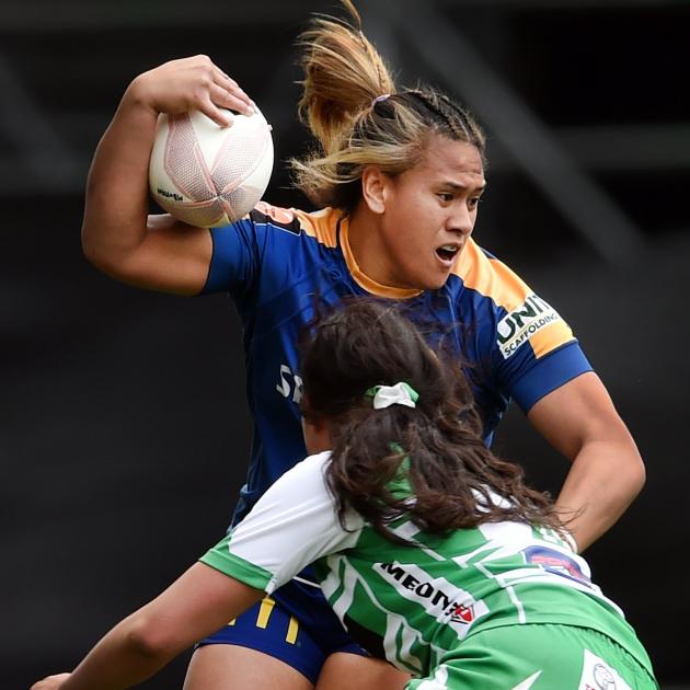 Otago Spirit second five-eighth Kilisitina Moata’ane is tackled by Manawatu lock Kahurangi...
