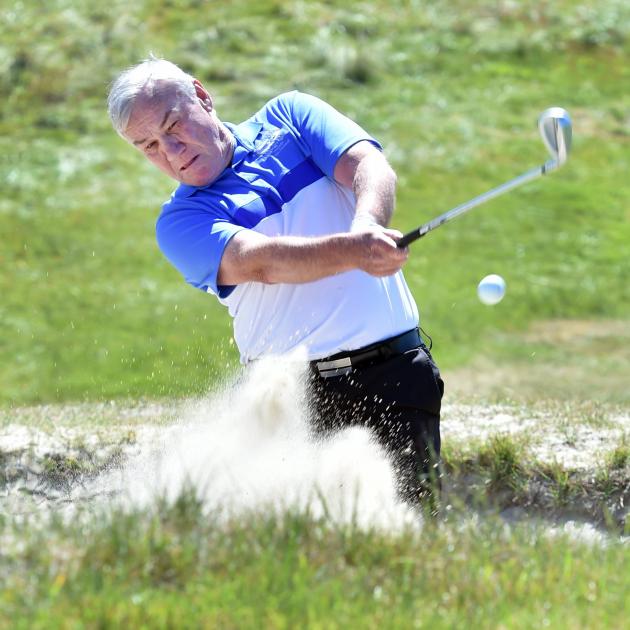 Alastair Hinsley swings out of a bunker at the Chisholm Links earlier this week. PHOTO: PETER...