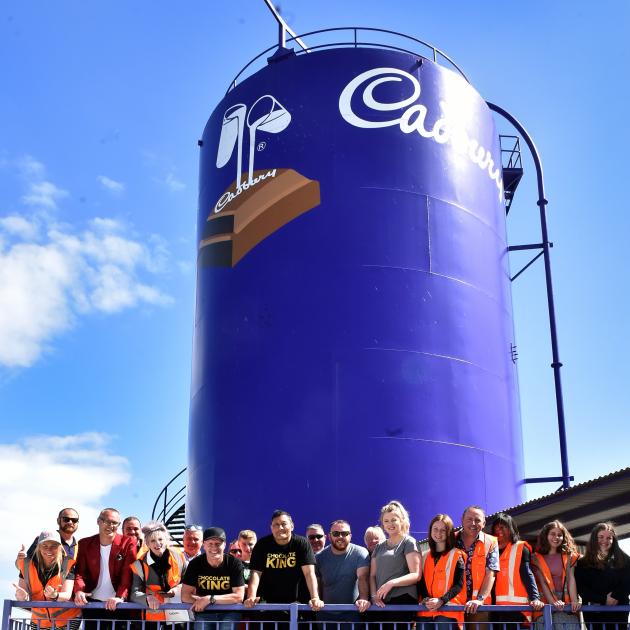 Those on the last tour through the former Cadbury factory stand next to the Cadbury silo. PHOTO:...