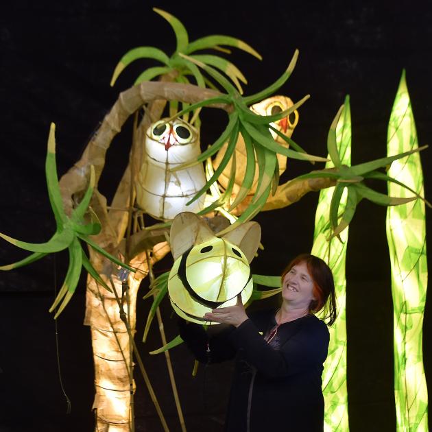 Artistic director Philipa Crofskey sets up Summer Lights, a display featuring lanterns from this...