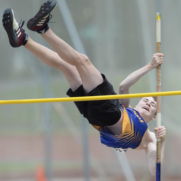 Taieri athlete Cole Gibbons clears the bar in the open pole vault at the Caledonian Ground on...