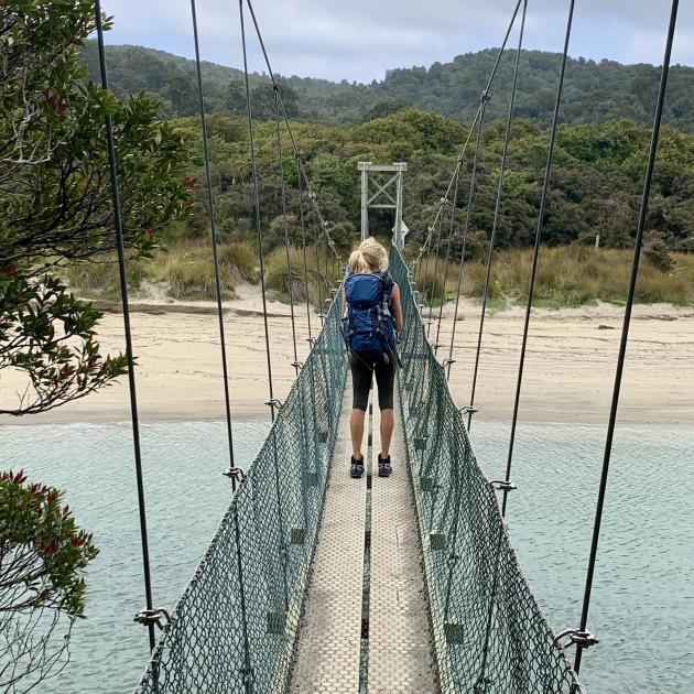 Swing bridge at Maori Beach.