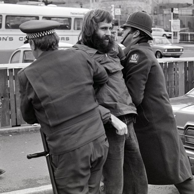 Protester Alastair Duncan is led away by police in Dunedin during a 1981 protest. PHOTO: ODT FILES