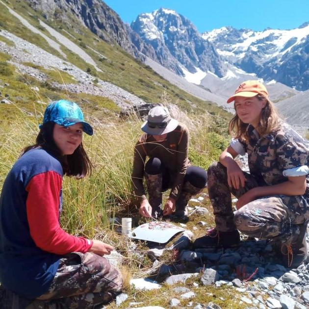 Ella Higgins and her sister make some tahr capriccio while waiting for the helicopter to pick...