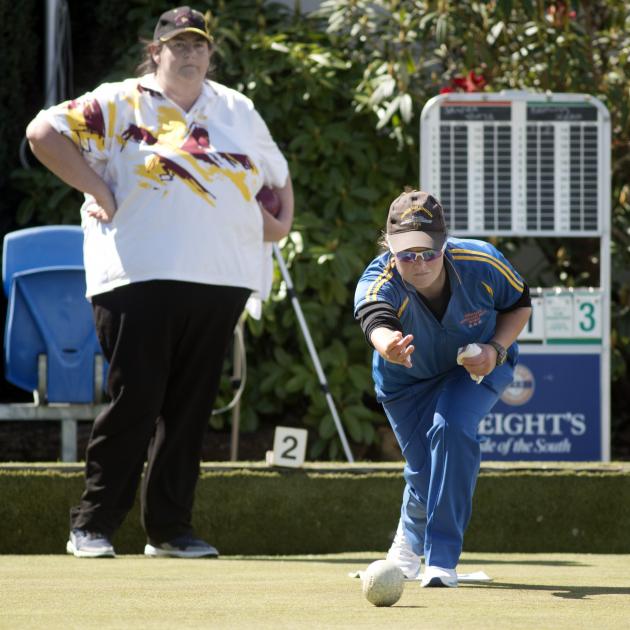 Sarah Scott delivers her bowl as Sandra Keith looks on during the final of the Dunedin Women’s...