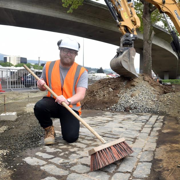 Archaeologist Braden McLean of Dunedin with uncovered paving under the overbridge in Wharf St. Photo: Peter McIntosh Archaeologist Braden McLean of Dunedin with uncovered paving under the overbridge in Wharf St. Photo: Peter McIntosh